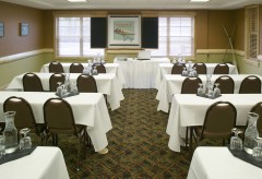 Meeting Room with small rectangular tables facing the front