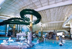 A photo of indoor waterpark, including the slides.