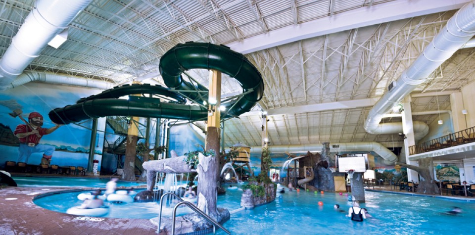 A photo of indoor waterpark, including the slides.